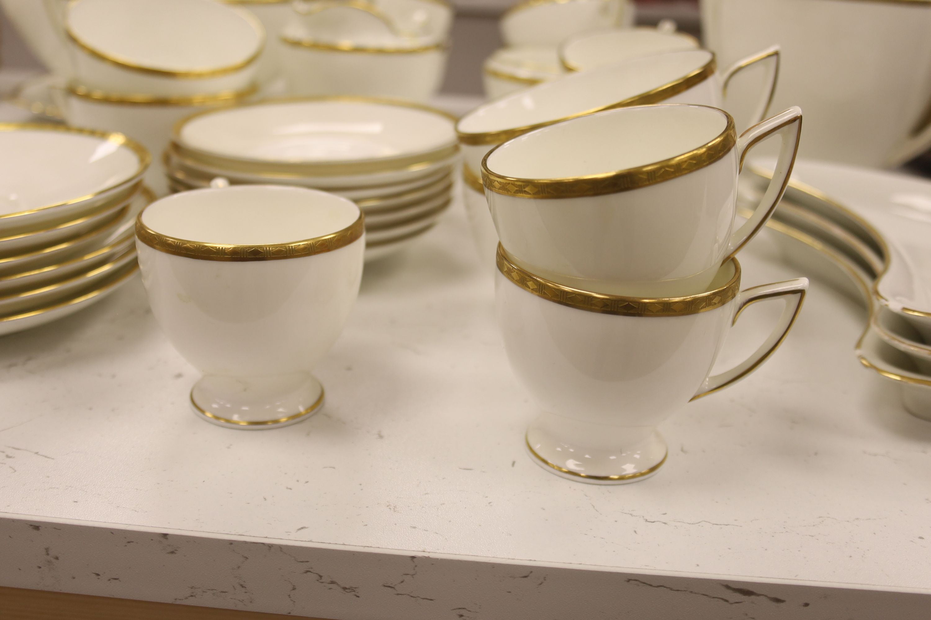 A Minton 'Golden Heritage' gilt bordered dinner service